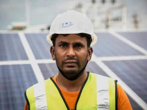 Man at a solar panel site, India